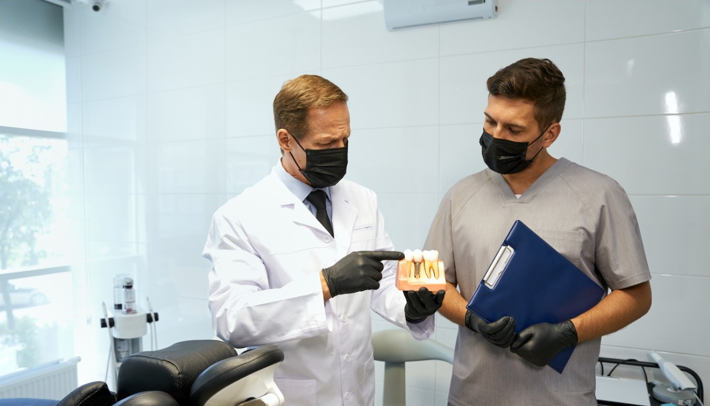 Instructors using smile model during dental assisting program