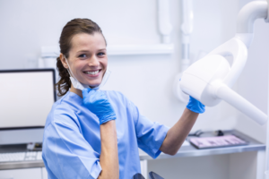 a closeup of a smiling dental assistant 