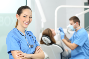 a closeup of a smiling dental assistant