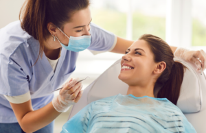 a dental assistant talking with a patient